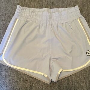 Vuori Light Lavender Athletic Running Shorts with Reflective Trim